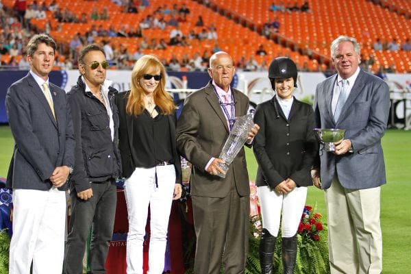 Jessica Springsteen accepting award with parents Bruce Springsteen and Patti Scialfa