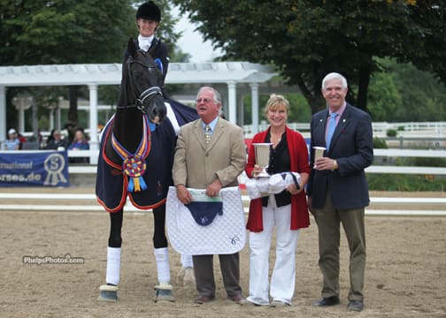 Photo:  Winner of the 2012 Markel/USEF Dressage Young Horse 6-Year-Old Class, Alice Tarjan and Somer Hit with jusge Axel Steiner, Markel's Mary Phelps and John Seger.