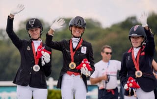 Individual Podium Grade V. L-R: Regine Mispelkamp (GER), Michèle GEORGE (BEL), and Sophie WELLS (GBR) at the Paris 2024 Paralympic Games. © FEI/Liz Gregg