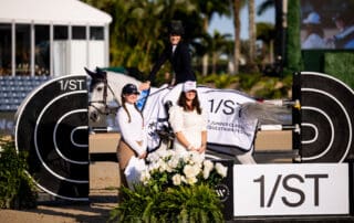 Jessica Springsteen & Naomi van het Keizershof are presented as winners of the $32,000 1/ST CSI2* Qualifier by Orlie Tonellato and Tiffani Steer, VP Communications, 1/ST & The Stronach Group. Photo © Ashley Neuhof