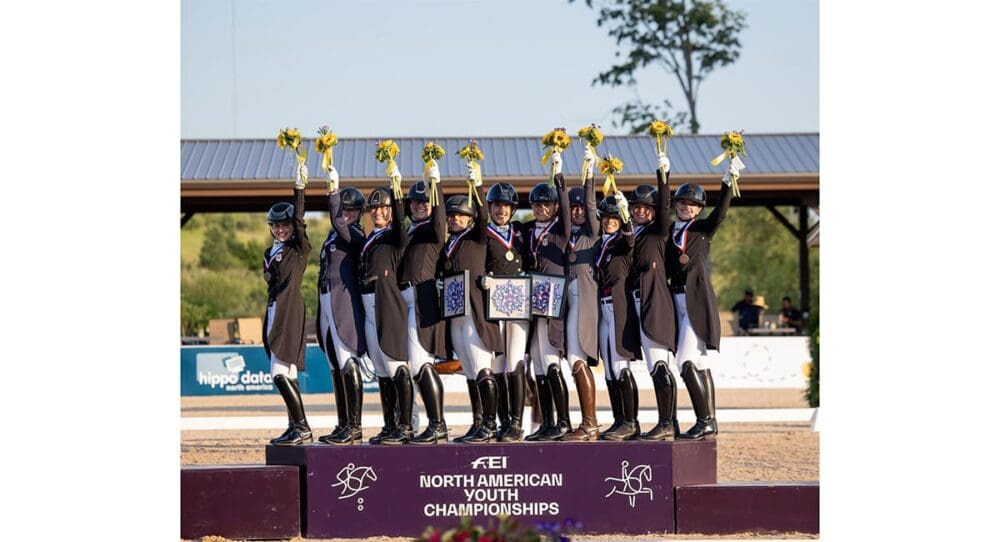 Zone 4 celebrates its gold medal in the FEI NAYC Children’s Team Competition alongside silver medalists Zone 10 and bronze medalists Team Canada at Flintfields Horse Park. Photo_Traverse City Horse Shows