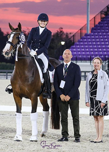 Ashley Holzer and Havanna 145 in their winning presentation with judge at C Peter Storr and show manager Debra Reinhardt. Photo by SusanJStickle.com.
