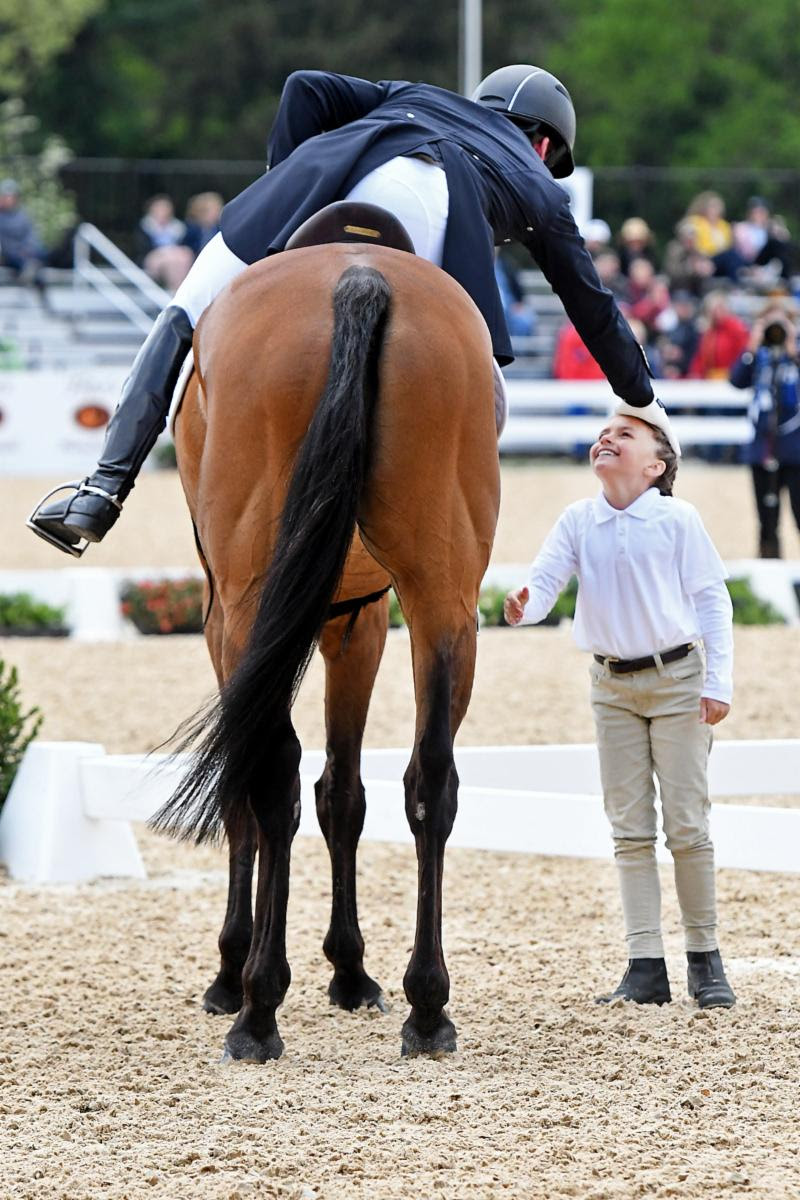 A sweet moment between Oliver Townend and Pony Club volunteer Suzanna Hall following his winning test. Hall's mother bought a horse from Townend last year and she wanted him to know the horse was still going well. He thanked her for volunteering and asked if they wanted to buy another one. Michelle Dunn Photo