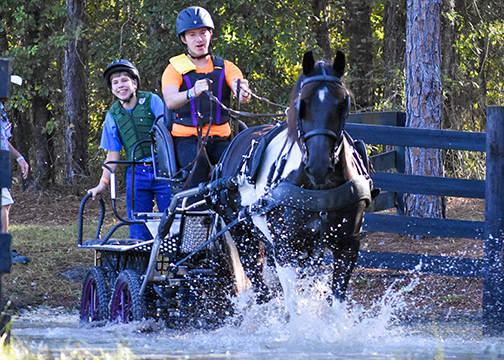 Nathanael Gaedtke navigating for Chris Carswell through a water obstacle.