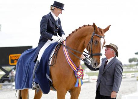 Judge Axel Steiner congratulates Mette Rosencrantz on her Grand Prix Special win aboard Finally