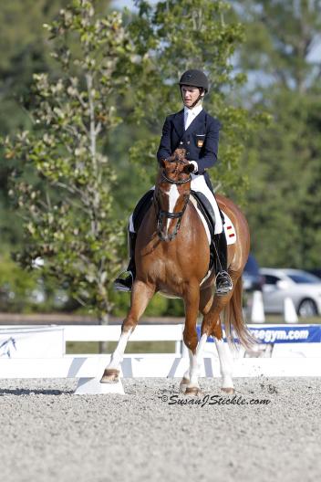 Juan Matute, Jr., 15, and Gasper, earn the second place ribbon in the Prix St. Georges (Photo: Susan J Stickle)
