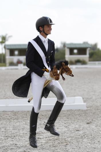 Juan Matute replaced Gasper with two stick horses for the Intermediaire 1 awards ceremony (Photo: Mary Adelaide Brakenridge)
