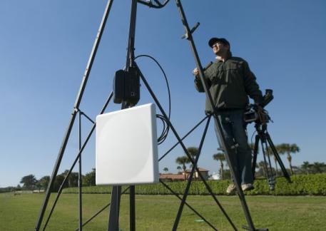 PoloNow Network's Eric Monahan preparing instant replay equipment and camera before the game. Photo by Scott Fisher