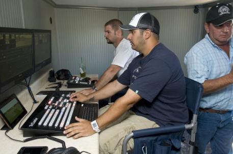 USPA umpire Steve Lane radios the onfield umpires after reviewing the instant replay with PoloNow's Mike Ferreira and Eric Monahan during a team challenge. Photo by Scott Fisher