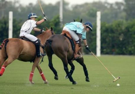 Grand Champions Blue player Riley Ganzi (2) reaches for the shot despite pressure from Landen Daniels (1) of Grand Champions Whilte. Photo by Scott Fisher