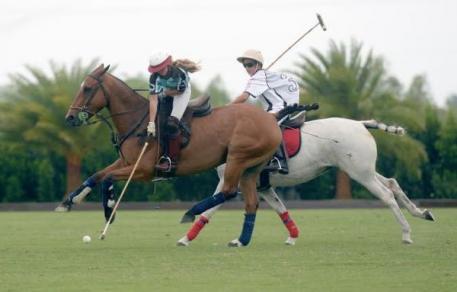 MVP Mia Astrada (3) of Grand Champions Blue drives downfield with Matias MacDonough Jr. (3) of Grand Champions White defending. Photo by Scott Fisher