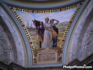 An image of a horse held by a rider is part of the artwork in the rotunda of the Kentucky State Capitol building.