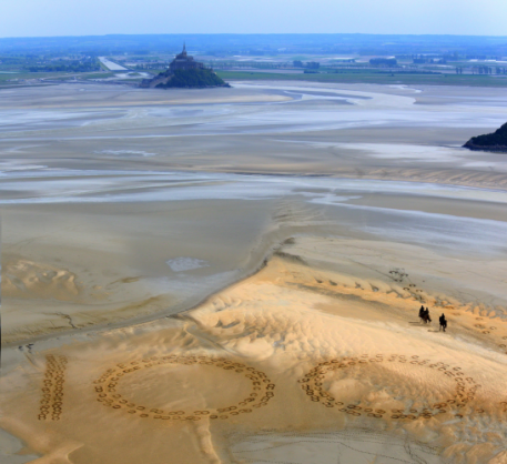 Giant 2.3m by 2.5m horse hoof prints created in the Bay of Mont-Saint-Michel, the famous UNESCO World Heritage Site, by French artist and sand sculptor Christophe Dumont, mark 100 days to the start of the Alltech FEI World Equestrian Games™ 2014 in Normandy, France this summer. (Photo: Dan Towers/FEI).