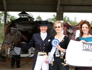 Tina Konyot (left) and her horse Calecto V won the Grand Prix Open class at the Gold Coast Dressage Association Opener. Draper Equine Therapy sponsored Konyot’s class and Show Manager Noreen O’Sullivan (center) and Draper Product Manager Kat Wojtylak presented Konyot with a Draper saddle pad.
