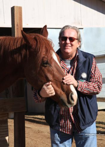 Keith Manfred owner of YourSano Nutrition visiting the Whispering Meadows Rescue Ranch, where he sponsors the powerful healing product EquisanoD. (Photo: Mary Phelps - phelpsphotos.com)