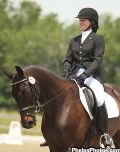 Heidi Joi Gayle Senior Claims Examener and dressage rider riding Somethingtoharbor.