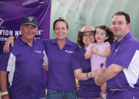 Dedicating their time to Pancreatic research, Wayne Humphreys and his family, Wendy DeTorres, Vicki, Veronica and son Seth Humphreys run the Purple Booth where Bouncer performs to raise awareness and funds.Photo: Mary Phelps - phelpsphotos.com