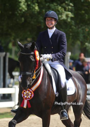 Charlotte and her 8-year-old black Dutch Warmblood gelding Adventure, by Ferro son Special D, won the 2013 Markel/USEF National Developing Horse Prix St. Georges Reserve Championship, 2013. (Photo: Mary Phelps)