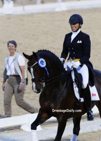 With KDA Dressage Show Manager Anne Kuhns ooking on Megan Lane and Caravella take their victory round. Photo:Mary Phelps