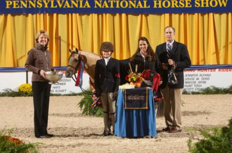 ARMANI and Madeline Schaefer receive the Grand Champion Pony Hunter Award from PNHS President Liz Shorb
