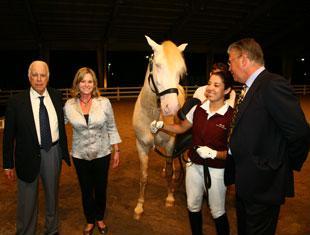 From left to right, Dr Paulo Gonzaga, Nancy Kempe, Monique da Silva, and Peter van Borst. Kempe, a dressage rider from Houston, Texas, was the highest bidder of the evening during the 2011 Lusitano Collection International Horse Auction, buying the beautiful Lusitano Isabel stallion Cupido Interagro. (Photo courtesy of Darcy Scott)