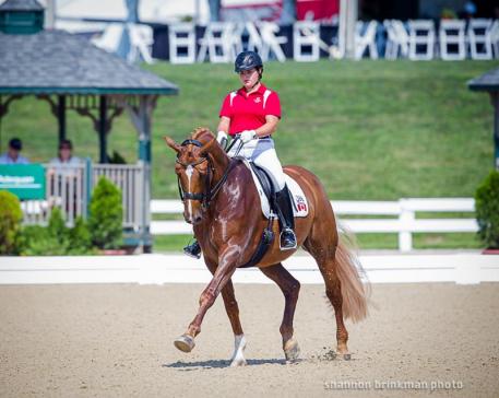 Tanya Shostak Strasser and Action Tyme in their FEI Young Rider Team Championship performance. (Photo: Anthony Trollope for Shannon Brinkman photo)