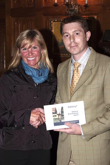 Jan Byyny (left) receives a certificate for Dubarry boots from Danny Hulse of Dubarry. (Michelle Dunn photo)