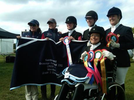 The Gold United States Para-Equestrian Team (Pictured Left to Right: Pam Lane, Chef d'equipe Missy Ransehousen, Rebecca Hart, Erin Alberda, Mary Jordan, and in front is Donna Ponessa).Photo: Hope Hand/USPEA.