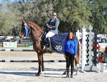 Aaron Vale and Spirit of Alena are presented with winner’s awards, including a Horze Equestrian cooler, after winning the ,000 HITS Grand Prix, presented by Zoetis, at HITS Ocala. ©ESI Photography