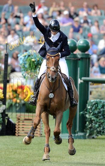 Angel Karolyi celebrates a clear jump-off performance with Hollow Creek Farm’s Indiana 127 in the 0,000 CNOOC Nexen Cup Derby at Spruce Meadows. Photo by Spruce Meadows Media Services