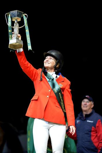 The USA’s Beezie Madden holds the trophy aloft after her sensational victory with Simon at the Rolex FEI World Cup™ Jumping Final 2012/2013 in Gothenburg, Sweden today.  Photo: FEI/Kit Houghton