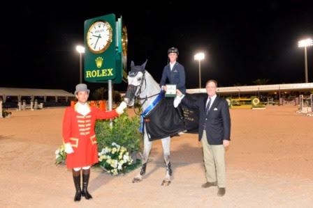 Peter Nicholson from Rolex USA presents Ben Maher with his Rolex watch. 