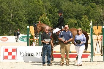 Catherine Tyree and Sandor de la Pomme, pictured with Bob Gunnison and Troy Pride of Purina Horse Feed, are presented as winners of the ,000 Manchester and the Mountains Grand Prix, presented by Purina Horse Feed. Photo by David Mullinix Photography 