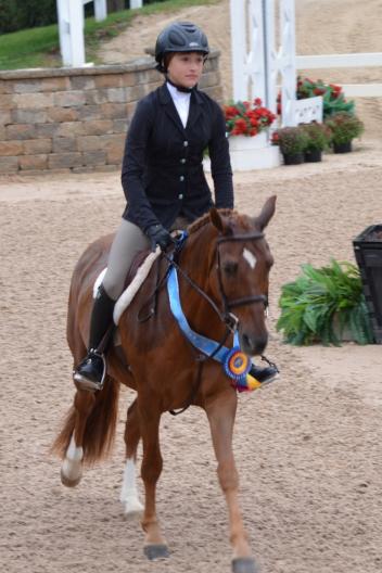Charlise Cassas taking the victory lap for the IHJA Pony Medal Final. Photo by Brenda Mueller.