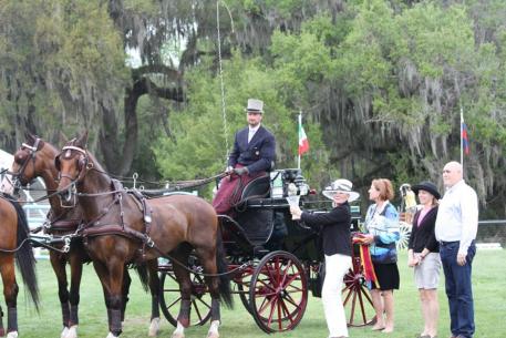 Julie Garella and Eric Williams present another National Championship Trophy to Ice Horse user, Chester Weber.