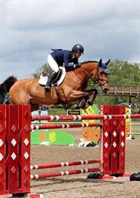 Christine McCrea and Avenir on their way to a two-for-two weekend at HITS Saugerties. (©ESI Photography)