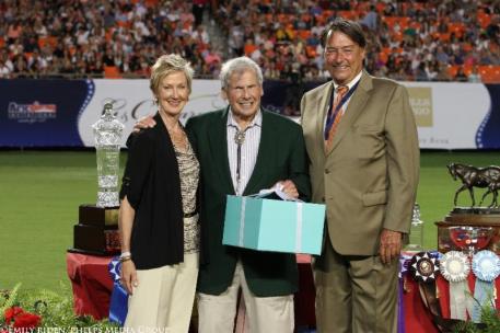 Dr. Daniel Marks accepts his award from Chrystine Tauber and Mason Phelps (photo © Emily Riden/Phelps Media Group)
