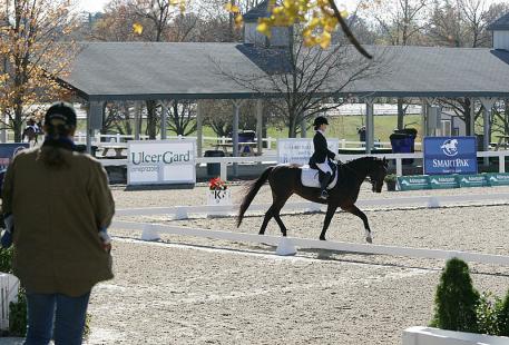 Shelly Schoenfeld owner of Donabella watches Cecilia Cox compete in the 2013 US Dressage Dressage Finals Photo: DressageDaily
