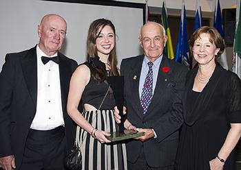  Jim Henry, Kaitlin Henry Armstrong, and Nancy Armstrong accepted the award from Jim Elder (second from right) on behalf of Doug Henry. Photo by Michelle C. Dunn