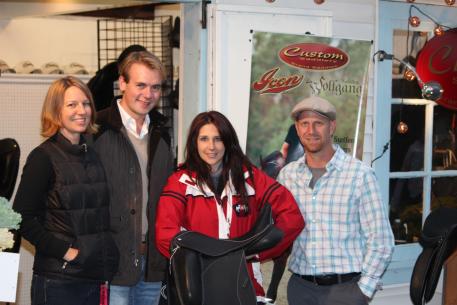 Heather Drake holds her new Custom Saddlery dressage saddle and is accompanied by Endel Ots, Tracie Montgomery(left) and Frank Taht (right).