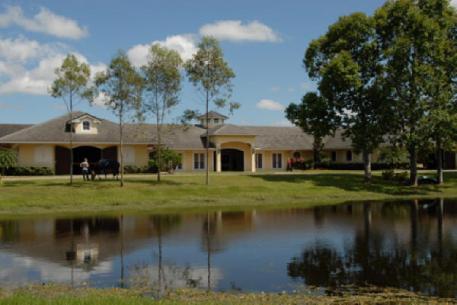 Stillpoint Farm is situated on 10 acres and features a 34-stall main stable divided into four private wings. The north and south wings contain their own wash racks, tack rooms, laundry rooms, offices, kitchens and full bathrooms. The covered arena is oversized with full kick boards and features Martin Collins Equestrian Surface's Ecotrack footing, a dust free surface that offers remarkable cushion and traction and is the footing of choice on many International venues.