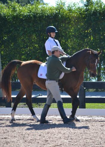 Robert Dover working with Robert Leuck, 14, who came with his family and pony to Wellingtong for the Christmas holiday to participate, December 26-31 at the Robert Dover Horsemastership Clinic and Emerging Dressage Athlete Program. (Photo: Jennifer Keeler)
