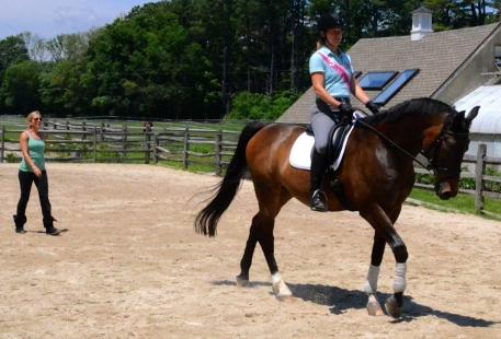 Jennifer watches for rider alignment that gives fluidity to the horse's movements. Photo: Gregor McQueen.