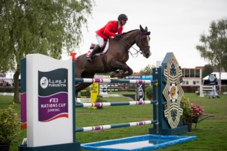 The Swiss team of Pius Schwizer, Romain Duguet, Paul Estermann and Steve Guerdat won the opening leg of the Furusiyya FEI Nations Cup™ Jumping Europe Division 1 series at Lummen, Belgium today without Olympic champion, Guerdat, having to jump a single fence.  Pictured are Romain Duguet and Quorida de Treho who produced one of the three double-clear performances that clinched it for the Swiss side. Photo: FEI/Dirk Caremans.