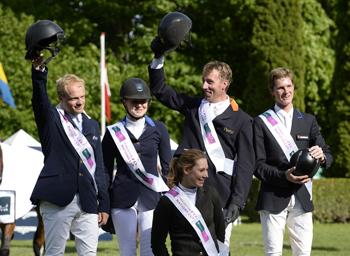 The Netherlands won the eighth leg of the Furusiyya FEI Nations Cup™ Jumping 2013 series at Copenhagen, Denmark today.  Pictured on the podium are (left to right) William Greve, Suzanne Tepper, Jur Vrieling and Hendrik-Jan Schuttert.  Photo: FEI/Annette Boe Ostergaard. 