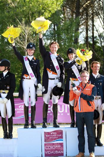 The Netherlands emerged victorious at the opening leg of the FEI Nations Cup™ Dressage pilot season at Vidauban, France yesterday.  Pictured on the podium are Katja Gevers, Laurens van Lieren and Stephanie Peters with trainer, Wim Ernes. (Photo: FEI/Rui Pedro Godinho)