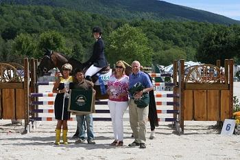 Emily Short and Grande Finale 3E celebrate their win in the ,000 Vermont Summer Celebration Grand Prix with, from left to right, Kimet Hand, groom Wilson Lopez, and John Hand of Hand Motors. Photo by David Mullinix Photography 