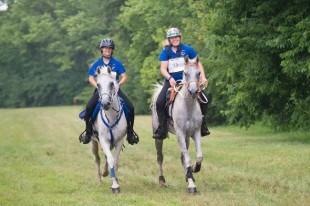 Endurance Team gold medallists Cassandra Roberts and Golden Lightning (left) and Morgan Watson and My Lords Elisha (right) also took Individual silver and gold for the Southeast Region at the FEI North American Championships for Juniors and Young Riders 2014 at Kentucky Horse Park in Lexington, USA.  Photo: StockImageServices.com/FEI