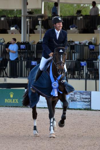 Eric Lamaze and Zigali P S, owned by Artisan Farms, celebrate their victory in the ,000 WEF Challenge Cup Round XI on March 20 at the FTI Consulting Winter Equestrian Festival in Wellington, FL. Photo by Starting Gate Communications Inc.