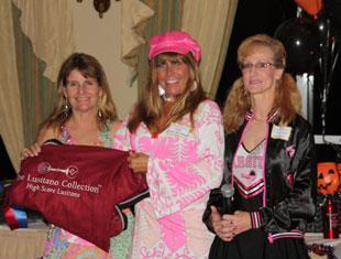 Heather Bender, left, shows off the cooler won by Black Tie Interagro, owned by Tracy Aubin of Connecticut. Bender and Black Tie Interagro won the Lusitano High Point Year End Award, sponsored by The Lusitano CollectionTM, at the Gold Coast Dressage Association. Missy Sage, center, and Noreen O’Sullivan, presented Bender with the award.